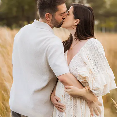 Lovers in an outdoor baby belly shoot with beautiful poses